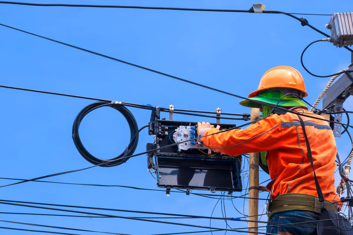 Fiber Optic Cable Installation on Poles